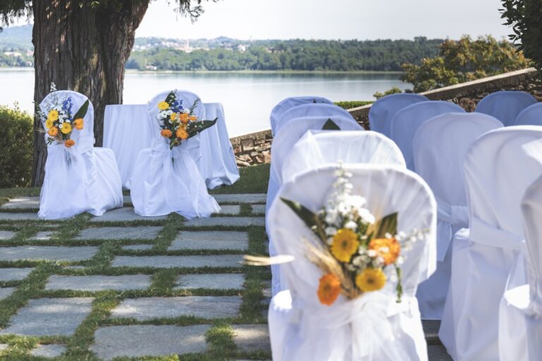 A diverse group of wedding guests, including a person using a wheelchair, enjoying an event together indoors.